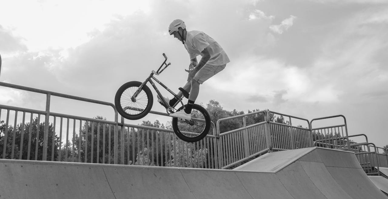 Man Performing Bmx Bike Tricks on Ramp